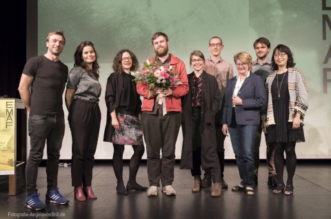 Preisverleihung 2018: Graeme Arnfield (mit Blumen), Jury und Kommission